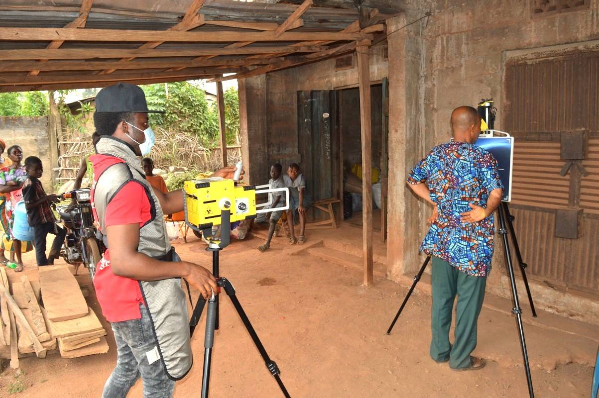 An elderly getting screened for TB using an AI powered device in Ikwo LGA of Ebonyi State