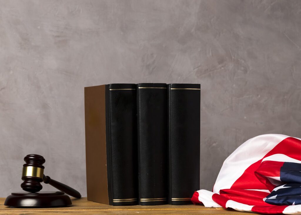 A picture of a law court table with the USA flag on it
