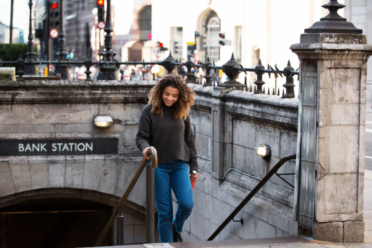 A lady at a United Kingdom Bank station