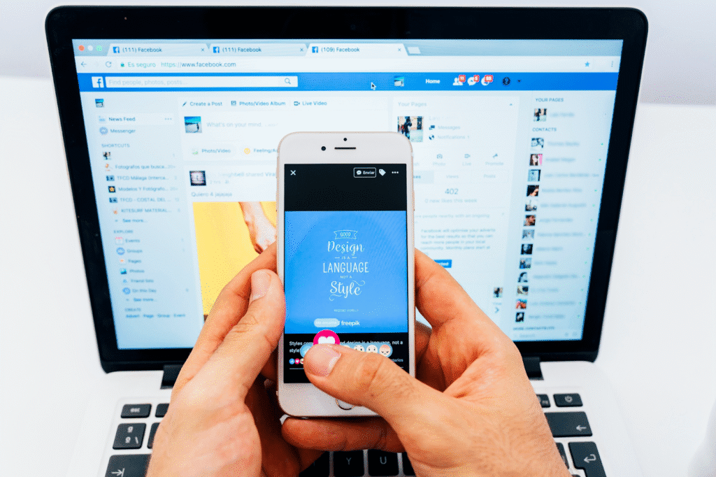 A picture of a laptop with Facebook post showing on the screen and a phone showing Facebook post on the screen too