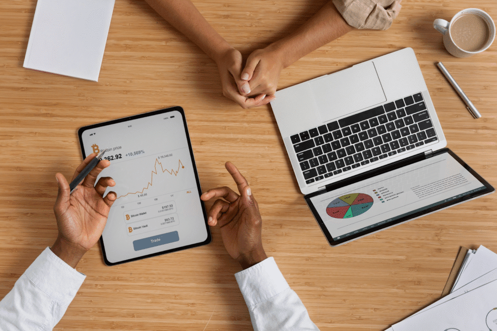 A picture showing a laptop and tablet of digital marketers monitoring their Facebook ad conversions